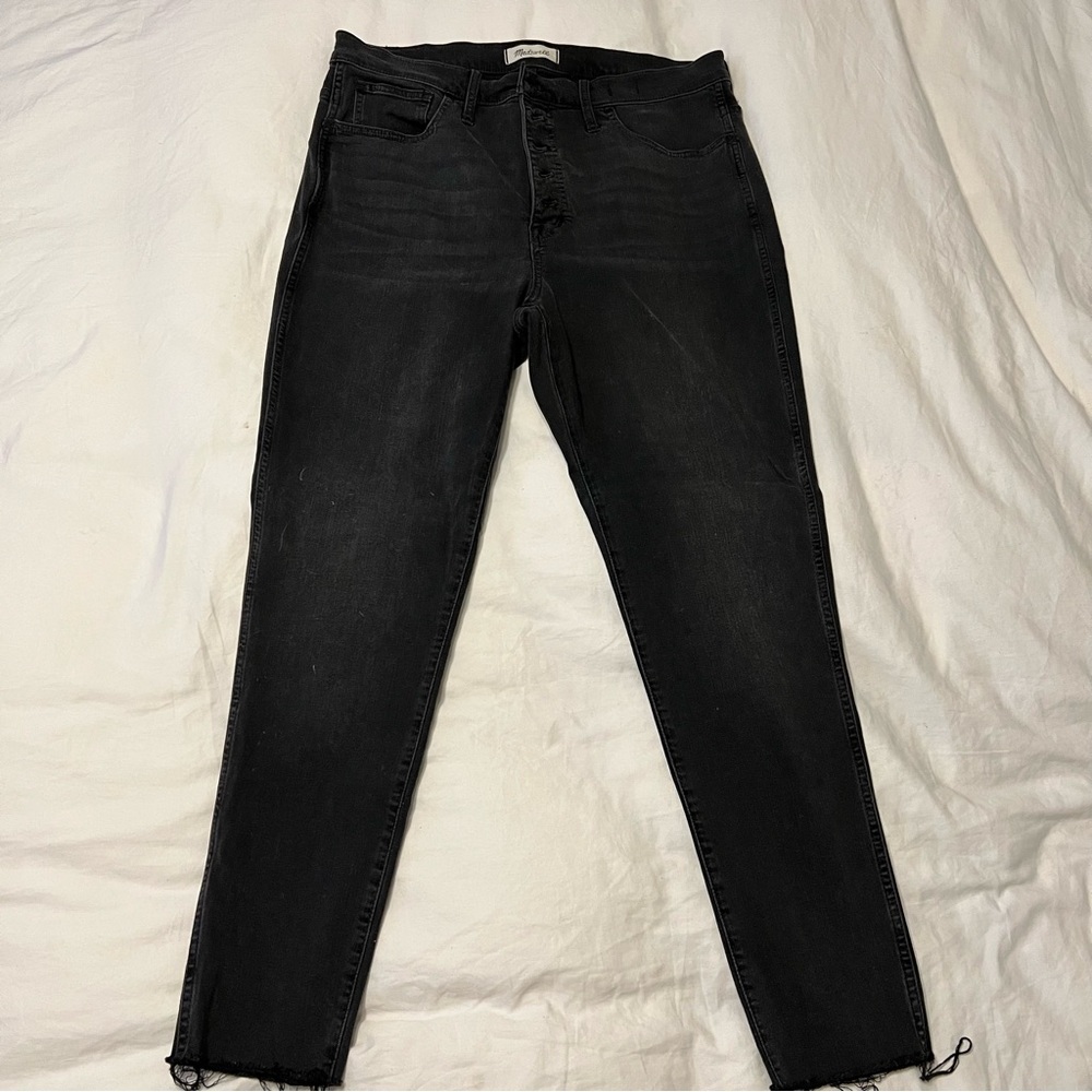 Madewell black washed high rise skinny jeans raw hem